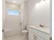 Bathroom features tub/shower combo with subway tile surround and single sink vanity at 1929 Nw 85Th Loop, Ocala, FL 34475