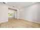 Light-filled bedroom with wood floors, white walls, and ample natural light at 1929 Nw 85Th Loop, Ocala, FL 34475