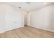 Spacious bedroom showcasing a large closet and light hardwood floors, offering comfort and style at 1929 Nw 85Th Loop, Ocala, FL 34475