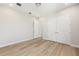 Bedroom with light hardwood floors and a closet featuring double doors and ample space at 1929 Nw 85Th Loop, Ocala, FL 34475