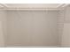Empty closet with ventilated shelving and white trim at 1929 Nw 85Th Loop, Ocala, FL 34475