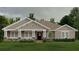 Charming single-story home featuring a welcoming front porch and stone accents for added curb appeal at 1929 Nw 85Th Loop, Ocala, FL 34475