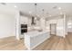 Bright kitchen featuring a large island with quartz countertop and stainless steel appliances at 1929 Nw 85Th Loop, Ocala, FL 34475