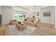 Bright living room with natural light, neutral tones, and open floor plan adjacent to the kitchen at 1929 Nw 85Th Loop, Ocala, FL 34475