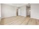 Spacious main bedroom with tray ceiling, light wood floors, and walk-in closet at 1929 Nw 85Th Loop, Ocala, FL 34475