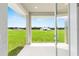 Covered patio with a view overlooking a lush green lawn and blue skies at 1929 Nw 85Th Loop, Ocala, FL 34475