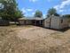 Backyard featuring a storage shed, partial grass, and a screened porch at 22 Hemlock Ter, Ocala, FL 34472