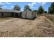 The property's backyard has a storage shed, partial grass, and a partial fence at 22 Hemlock Ter, Ocala, FL 34472