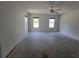 Light-filled bedroom with fan and two windows offering plenty of natural light at 22 Hemlock Ter, Ocala, FL 34472
