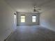 Bright bedroom with fan and two windows offering great natural lighting at 22 Hemlock Ter, Ocala, FL 34472