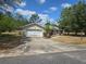 Single-Gathering home with a two-car garage and a well-maintained, though dry, front yard at 22 Hemlock Ter, Ocala, FL 34472