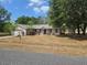 Single-Gathering home with a two-car garage and a well-maintained, though dry, front yard at 22 Hemlock Ter, Ocala, FL 34472