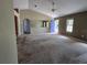 Open living room with vaulted ceiling, carpeted floors, and ample space at 22 Hemlock Ter, Ocala, FL 34472