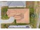 An overhead view shows a well-maintained roof, driveway, landscaping, and surrounding neighborhood at 2399 Nw 53Rd Avenue Rd, Ocala, FL 34482
