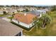 An aerial shot shows a well-kept backyard, complete with hedges and manicured landscaping at 2399 Nw 53Rd Avenue Rd, Ocala, FL 34482
