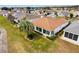 A well-manicured lawn and hedges surround a house with large windows, creating a private backyard at 2399 Nw 53Rd Avenue Rd, Ocala, FL 34482