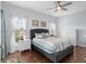 Bright bedroom with hardwood floors, dresser, and bedside table at 2399 Nw 53Rd Avenue Rd, Ocala, FL 34482