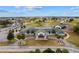 Community clubhouse with green roof, parking, and meticulously maintained landscaping in a planned community at 2399 Nw 53Rd Avenue Rd, Ocala, FL 34482
