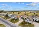 Well-maintained homes with manicured lawns, driveways, and lush landscaping along a quiet street at 2399 Nw 53Rd Avenue Rd, Ocala, FL 34482