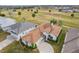 An elevated view shows a well-maintained home with mature landscaping and a paved driveway at 2399 Nw 53Rd Avenue Rd, Ocala, FL 34482