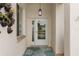 Inviting front entry with decorative flower pots, window, and tiled floor at 2399 Nw 53Rd Avenue Rd, Ocala, FL 34482