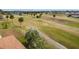 An aerial shot shows a path winding through a lush golf course with mature palm trees at 2399 Nw 53Rd Avenue Rd, Ocala, FL 34482