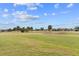 Beautiful view of the sprawling green golf course under a partly cloudy sky at 2399 Nw 53Rd Avenue Rd, Ocala, FL 34482