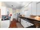 Well-maintained kitchen with stainless steel appliances, ample counter space, and wood floors at 2399 Nw 53Rd Avenue Rd, Ocala, FL 34482