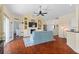Bright living room features hardwood floors and a decorative fireplace at 2399 Nw 53Rd Avenue Rd, Ocala, FL 34482