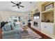 Cozy living room with hardwood floors, fireplace and access to lanai at 2399 Nw 53Rd Avenue Rd, Ocala, FL 34482
