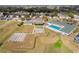 Aerial shot of community amenities, with a pool, bocce courts and tennis courts for active lifestyles at 2399 Nw 53Rd Avenue Rd, Ocala, FL 34482