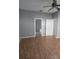 Bright bedroom boasts wood laminate flooring, neutral walls, and a ceiling fan for enhanced air circulation at 2637 Ne 27Th St, Ocala, FL 34470