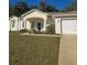 Charming single-story home with a well-maintained lawn and attached two-car garage at 2637 Ne 27Th St, Ocala, FL 34470