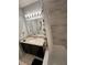 Bathroom with a large mirror, granite countertop, tile flooring, and tub with shower at 2923 Antique Oaks Cir # 39, Winter Park, FL 32792