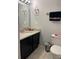 Bathroom showcasing vanity with granite countertop, toilet, and modern fixtures at 2923 Antique Oaks Cir # 39, Winter Park, FL 32792
