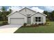 Charming single-Gathering home with a well-maintained lawn and neutral-colored exterior at 360 Hickory Course Trl, Ocala, FL 34472