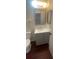 Updated bathroom featuring a modern gray vanity with storage and a sleek white countertop and mirror at 4 Pine Pass Ter, Ocala, FL 34472