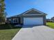 Well maintained single story home with a 2 car garage and a manicured front lawn at 4838 Sw 130Th St, Ocala, FL 34473