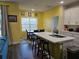 Bright eat-in kitchen featuring a large island, stainless steel appliances, and an open concept layout at 4838 Sw 130Th St, Ocala, FL 34473
