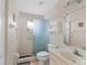 Well-lit bathroom featuring a glass-enclosed shower, vanity with sink, and neutral color scheme at 5040 Nw 35Th St, Ocala, FL 34482