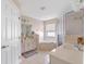 Spacious bathroom with a garden tub, a glass-enclosed shower, and double vanity sinks at 5040 Nw 35Th St, Ocala, FL 34482