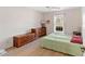 Bright bedroom with wood floors, a large window, and traditional furniture at 5040 Nw 35Th St, Ocala, FL 34482