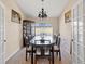 Formal dining room showcasing a dark wood table and chairs, plus a decorative chandelier at 5040 Nw 35Th St, Ocala, FL 34482
