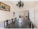 Elegant dining room with a dark wood table and chandelier, open to the living area at 5040 Nw 35Th St, Ocala, FL 34482
