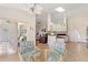 Bright kitchen featuring a skylight and an eat-in nook with a glass-top table and chairs at 5040 Nw 35Th St, Ocala, FL 34482