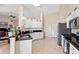Bright kitchen featuring white cabinets, granite countertops, and stainless steel appliances at 5040 Nw 35Th St, Ocala, FL 34482