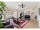 Bright living room with cathedral ceiling, fan and door to the back yard at 5040 Nw 35Th St, Ocala, FL 34482