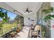 Relaxing screened porch with plants, seating, and views of the backyard at 5040 Nw 35Th St, Ocala, FL 34482