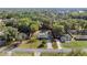 Aerial view of property showing the layout, spacious yard, pool, shed, and surrounding trees at 5906 Sw 108Th St, Ocala, FL 34476