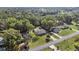 Aerial view of a home surrounded by lush greenery and mature trees at 5906 Sw 108Th St, Ocala, FL 34476